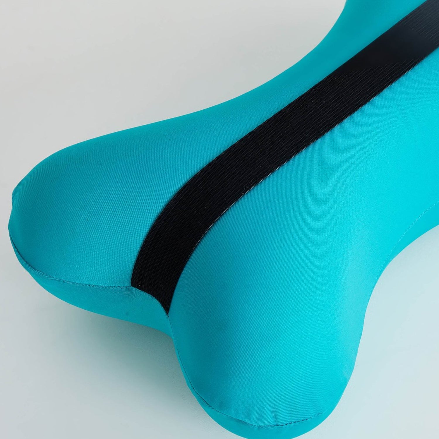 Side view showing bone type design of travel pillow. Side view showing bone type design of travel pillow.